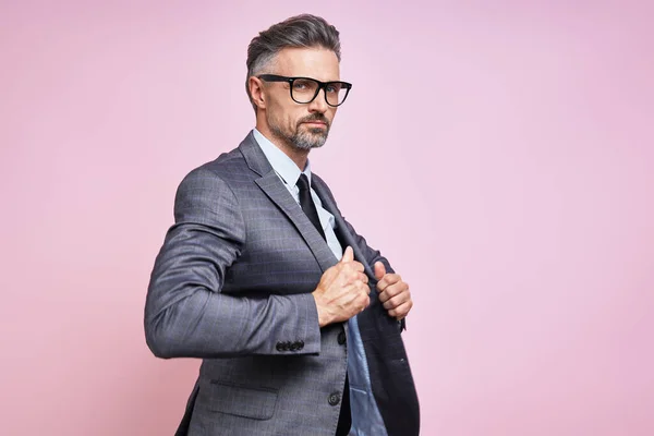 Handsome Mature Man Formalwear Adjusting His Jacket While Standing Pink — Foto Stock