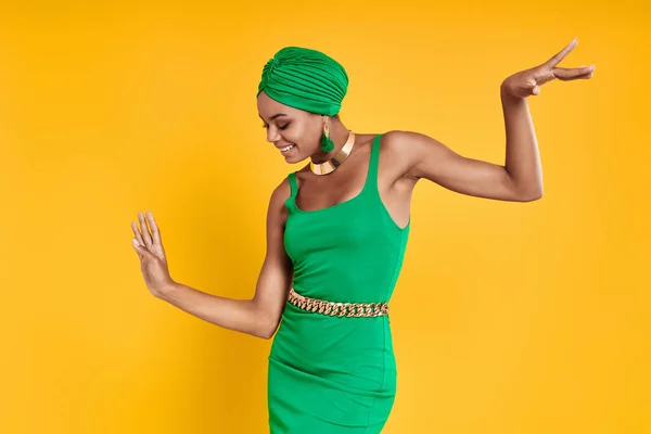 Attractive African Woman Traditional Headwear Dancing Yellow Background — Stock Photo, Image