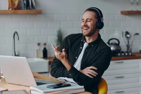 Cheerful Young Man Headphones Talking Gesturing While Having Web Conference — Stock Photo, Image