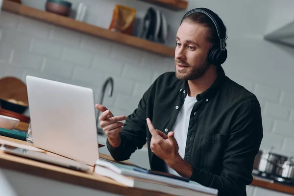 Handsome Young Man Headphones Talking Gesturing While Having Web Conference — Stock Photo, Image