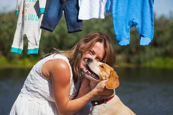 Woman with her cute and playful dog — Stock Photo, Image