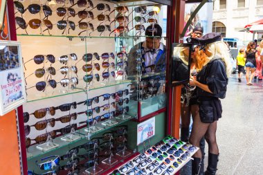 Women buying sunglasses clipart