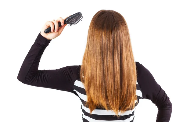 Woman brushing her hair — Stock Photo, Image