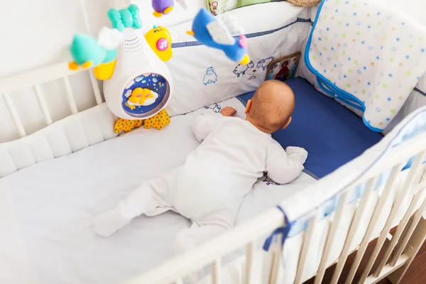 Baby in crib — Stock Photo, Image