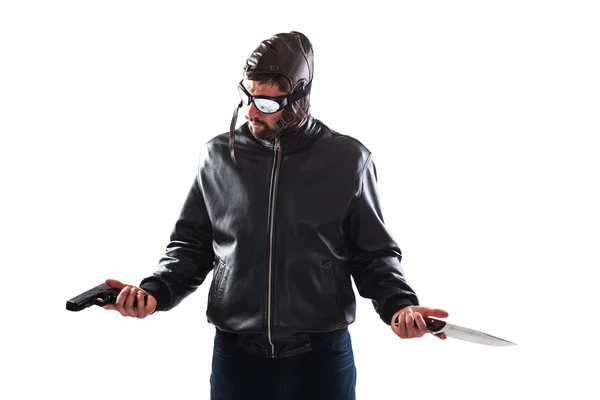 Hesitant assassin choosing his weapon — Stock Photo, Image