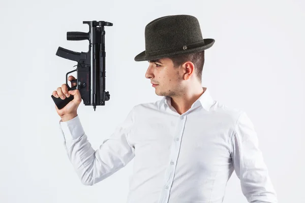 Italian assassin holding gun — Stock Photo, Image