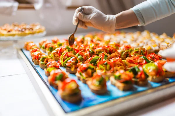 Final touch for tasty canapes — Stock Photo, Image