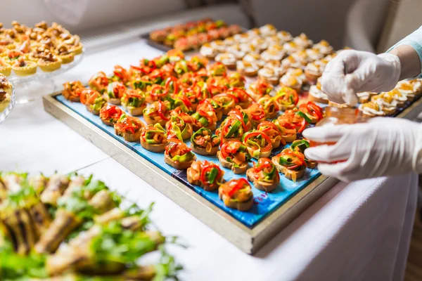 Final touch for delicious canapes — Stock Photo, Image