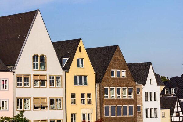 Aligned house rooftops in Cologne, Germany.