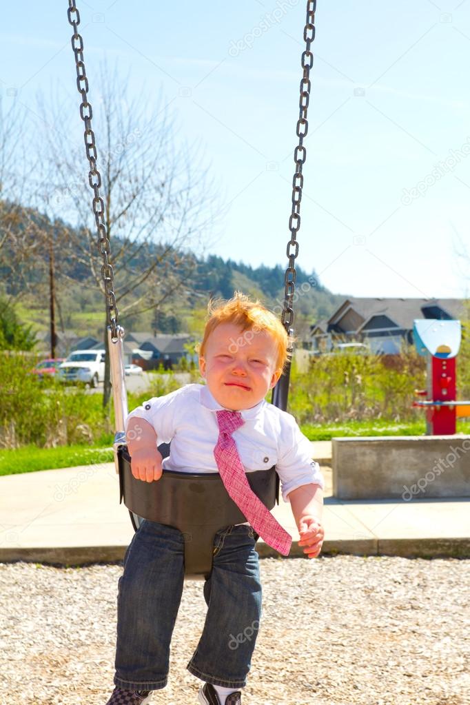 Crying Boy on Swing