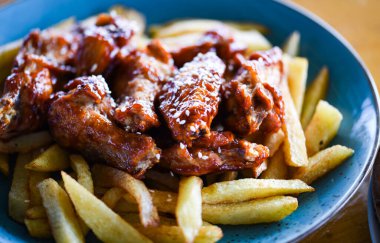 crispy barbecue chicken wings with fries