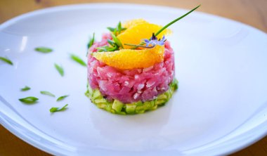 delicious tuna tartar with fresh avocado and orange