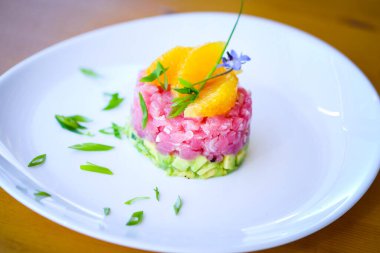 delicious tuna tartar with fresh avocado and orange
