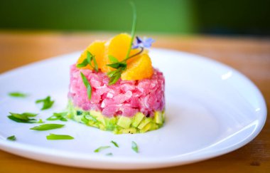 delicious tuna tartar with fresh avocado and orange
