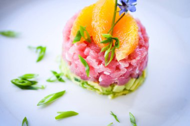 delicious tuna tartar with fresh avocado and orange