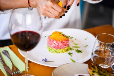 delicious tuna tartar with fresh avocado and orange