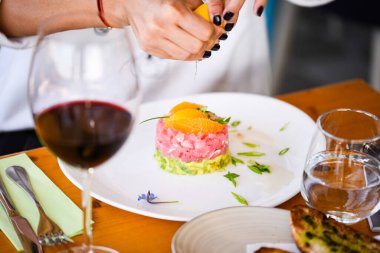delicious tuna tartar with fresh avocado and orange