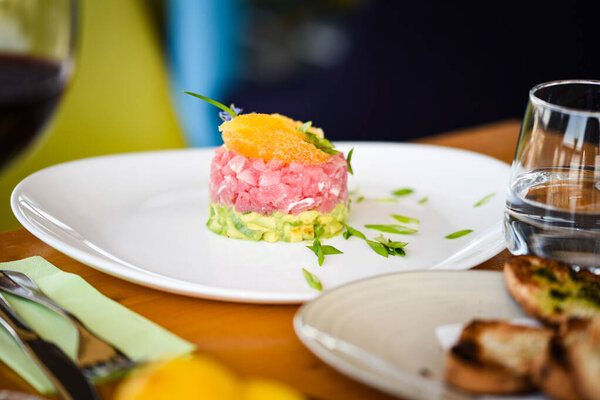 delicious tuna tartar with fresh avocado and orange