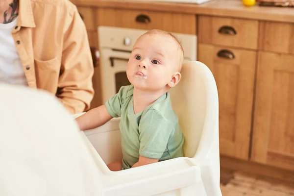 Close Cute Nine Month Old Baby Boy Green Shirt Sits — Stock Photo, Image