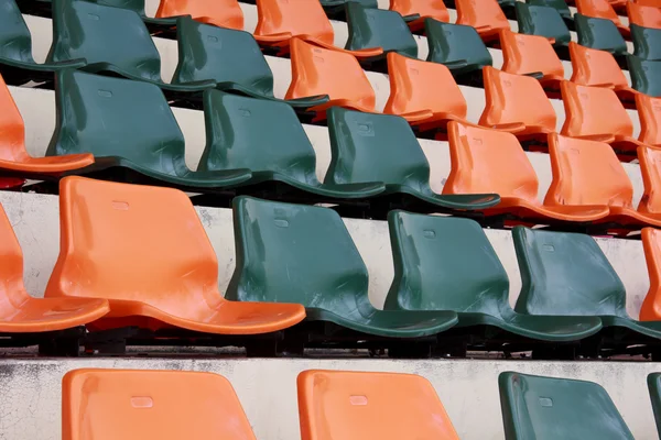 Rows of red mini-football stadium empty seats — Stock Photo, Image