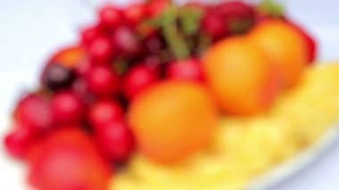 Fresh fruit on a plate.Sliced fresh fruit.