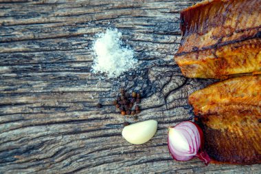 Sea fish cooked on the barbecue. Sea fish fillet baked on the grill. The concept of folk cuisine, restaurant, cooking. 