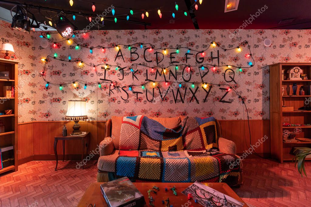Paris, France - June 27, 2022: Living room of Joyce with lights and alphabets on the wall in Stranger Things Pop-up store on avenue Champs Elysees