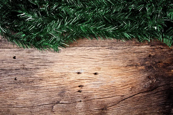 Christmas fir tree on a wooden board — Stock Photo, Image