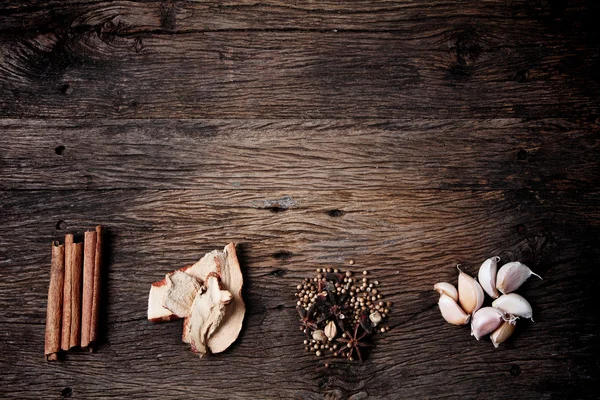 Still life with spices on old wooden table — Stock Photo, Image
