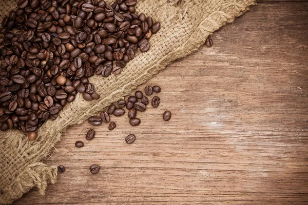 Fresh coffee beans on wood background — Stock Photo, Image