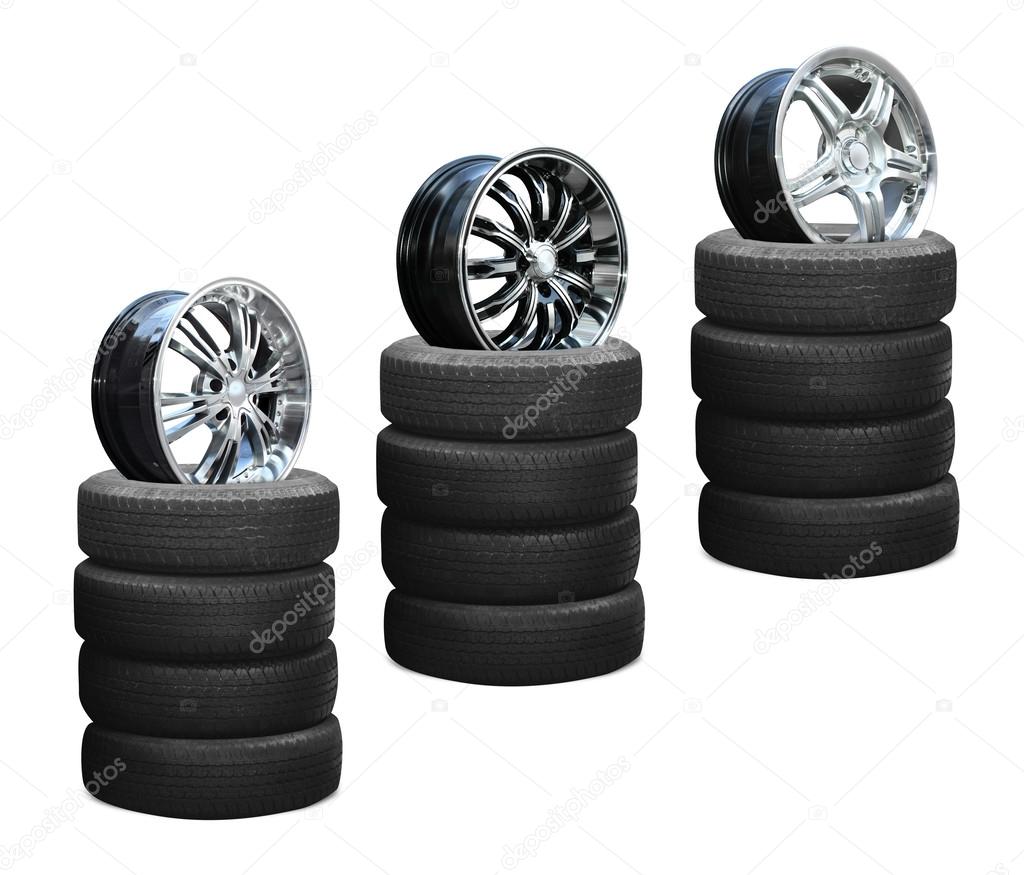 Car alloy wheel on tires isolated over white background
