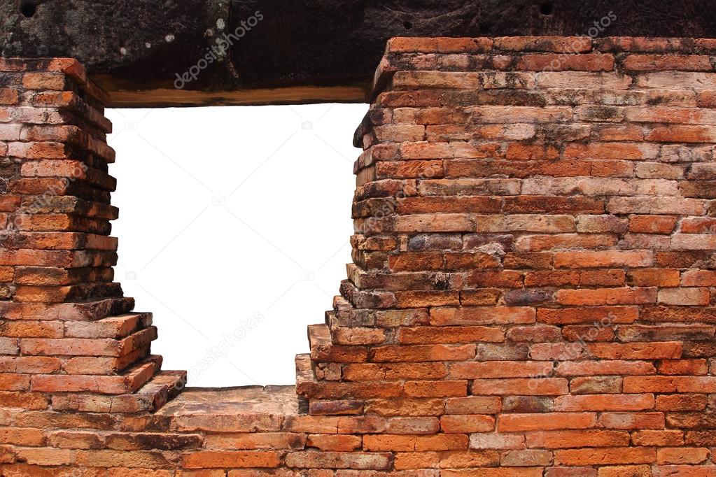 Old brick wall with hole for window