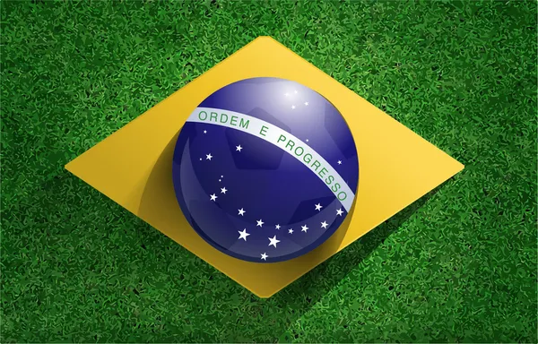 Piłka z flaga Brazylii na boisko do piłki nożnej — Wektor stockowy
