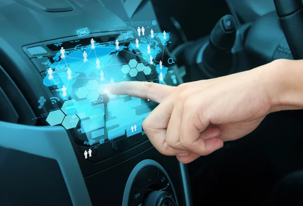 Pushing on a touch screen in car — Stock Photo, Image