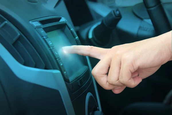 Driver entering an address into the navigation system — Stock Photo, Image