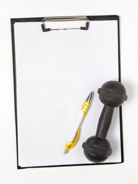 Blank notepad paper and pen and dumbbell — Stock Photo, Image