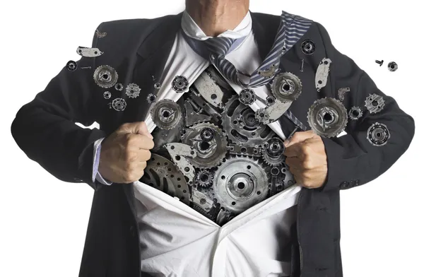Podnikatel ukazující oblek superhrdiny pod stroje kovových zařízení myšlenkou koncepce — Stock fotografie