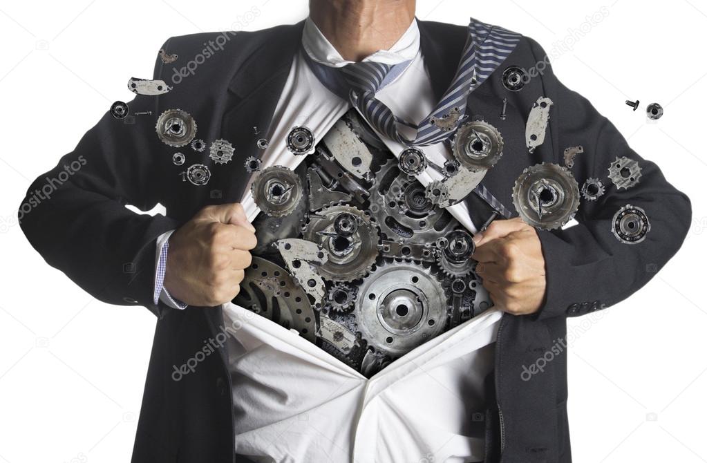 Businessman showing a superhero suit underneath machinery metal gears idea concept
