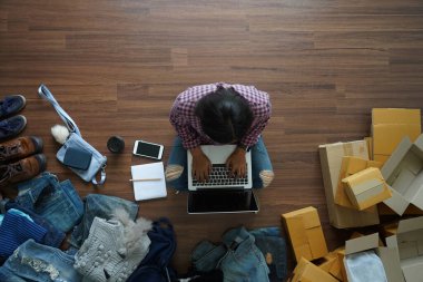 Selling online start up small business owner SME idea concept, Top view of women using laptop computer from home on wooden floor
