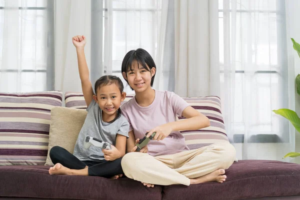 Happy Asian Girl Sister Playing Video Game Using Joystick Controller — Stock Photo, Image