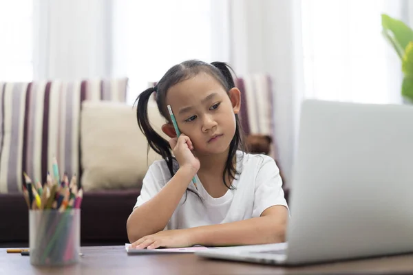 Asian Girl Thoughtful Studying Homework Online Lesson Home Social Distance — Stock Photo, Image