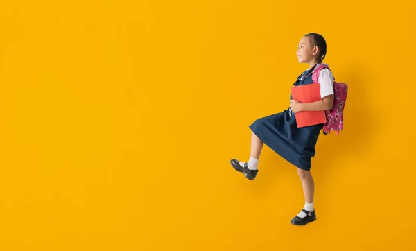 Asian Student Child Girl Wears School Uniform Holding Book Walking — Zdjęcie stockowe