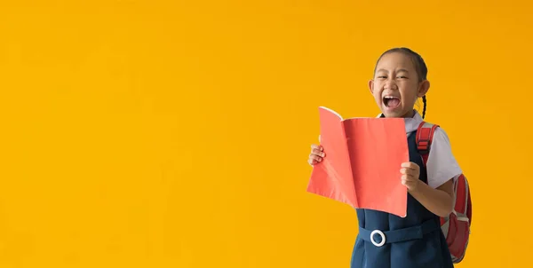 Funny Smiling Child School Girl Hold Books Isolated Yellow Background — 스톡 사진