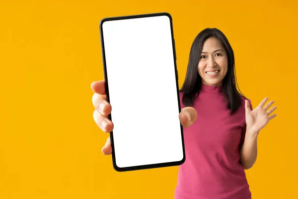 Happy Asian Woman Holding Big Smartphone Yellow Background Isolated Clipping — Foto Stock