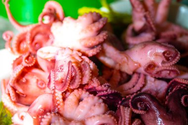 Little octopuses on a plate on the table. Seafood