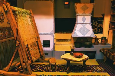 Close up of gold silk weaving on loom, cotton on the manual wood loom in traditional culture