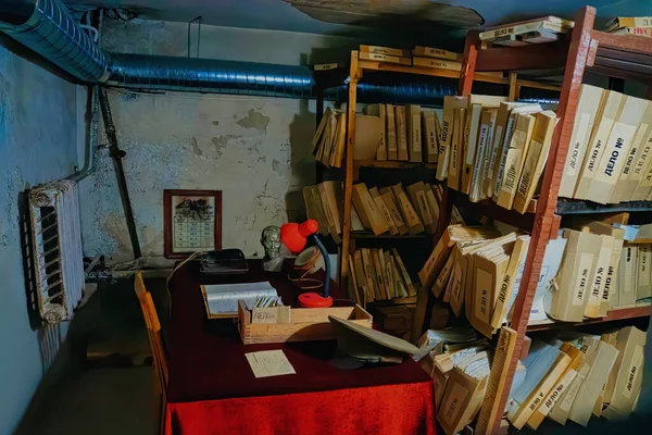 Folder storage room details in metal shelves wooden brown cases with police evidence