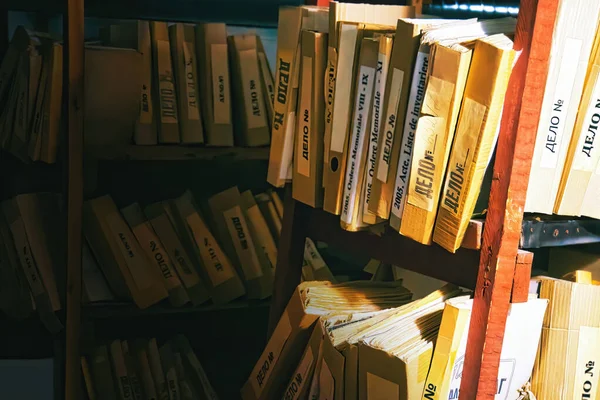 Folder storage room details in metal shelves wooden brown cases with police evidence