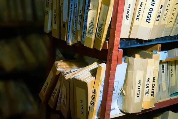 Folder storage room details in metal shelves wooden brown cases with police evidence