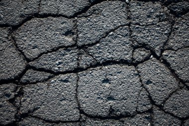 Çatlaklı asfalt yol. Arkaplan dokusu
